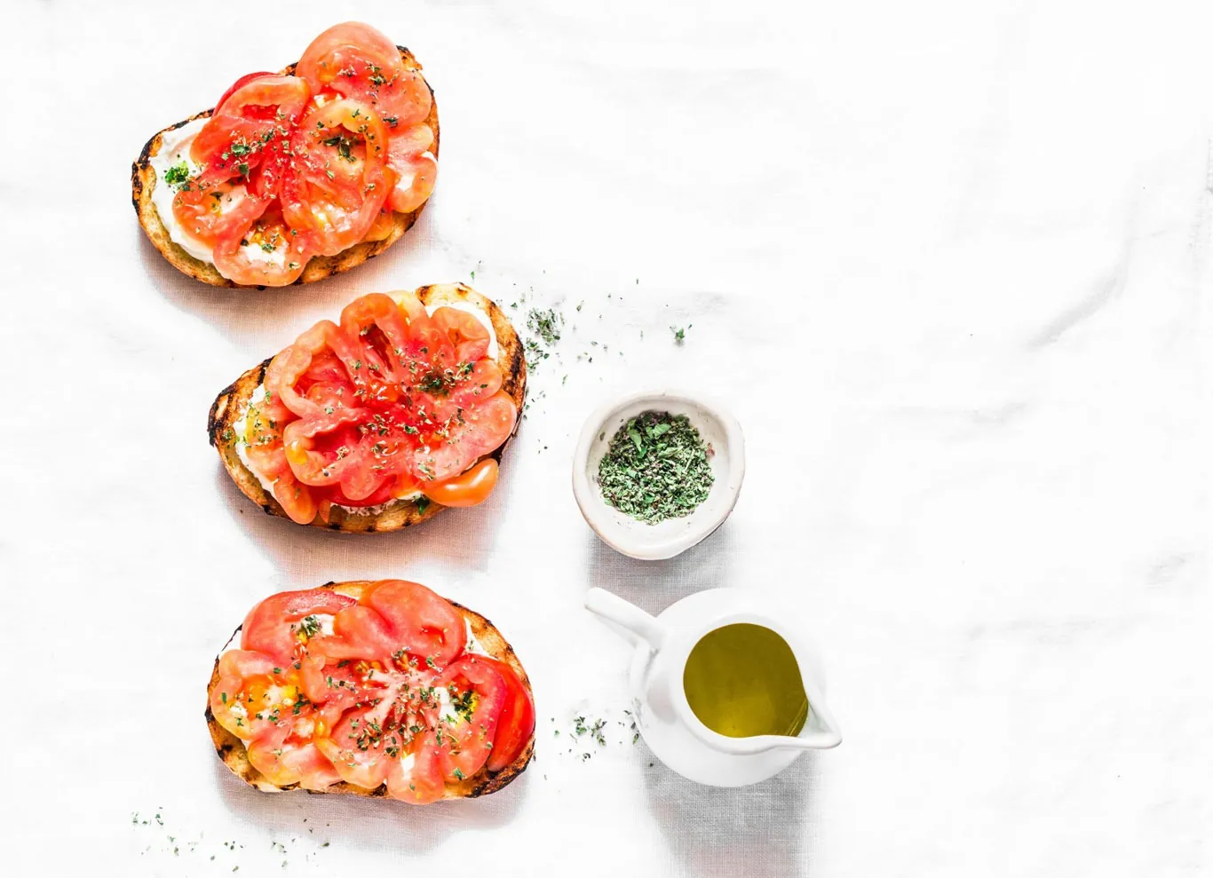 Bruschetta topped with tomatoes and basil