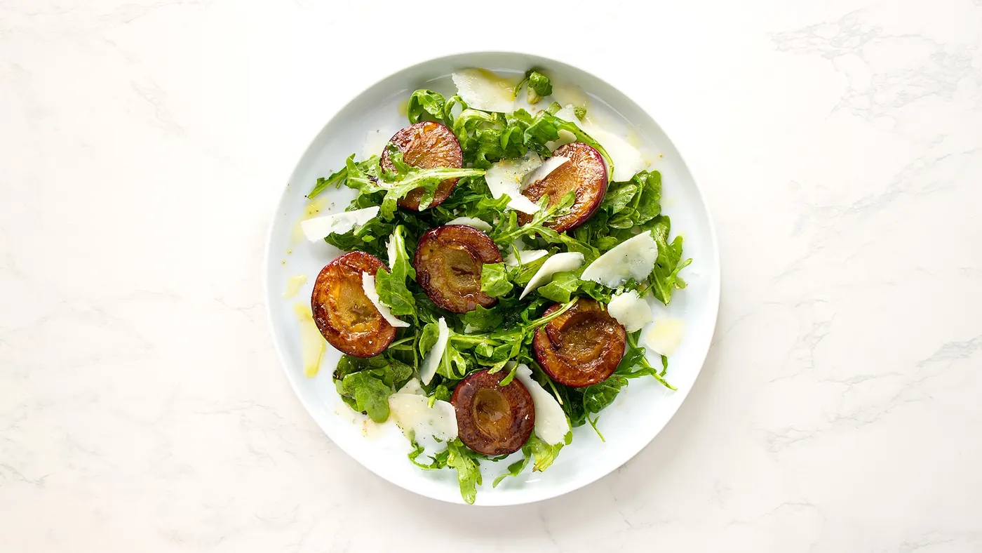 Arugula Salad with Roasted Plums and Shaved Pecorino Romano